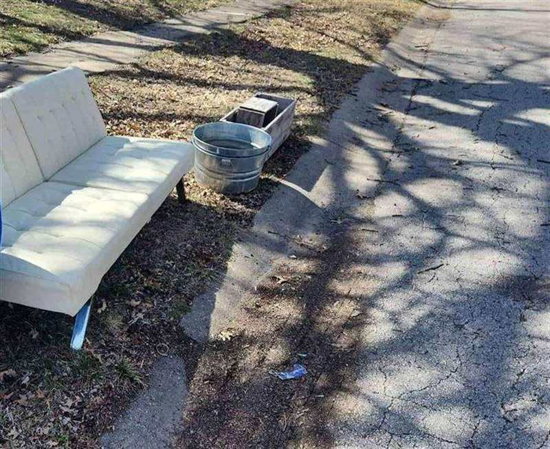 White futon couch, a galvanized tub and a wooden planter box waiting at the curb for A Plus Junk Removal KC pickup in the Kansas City metro