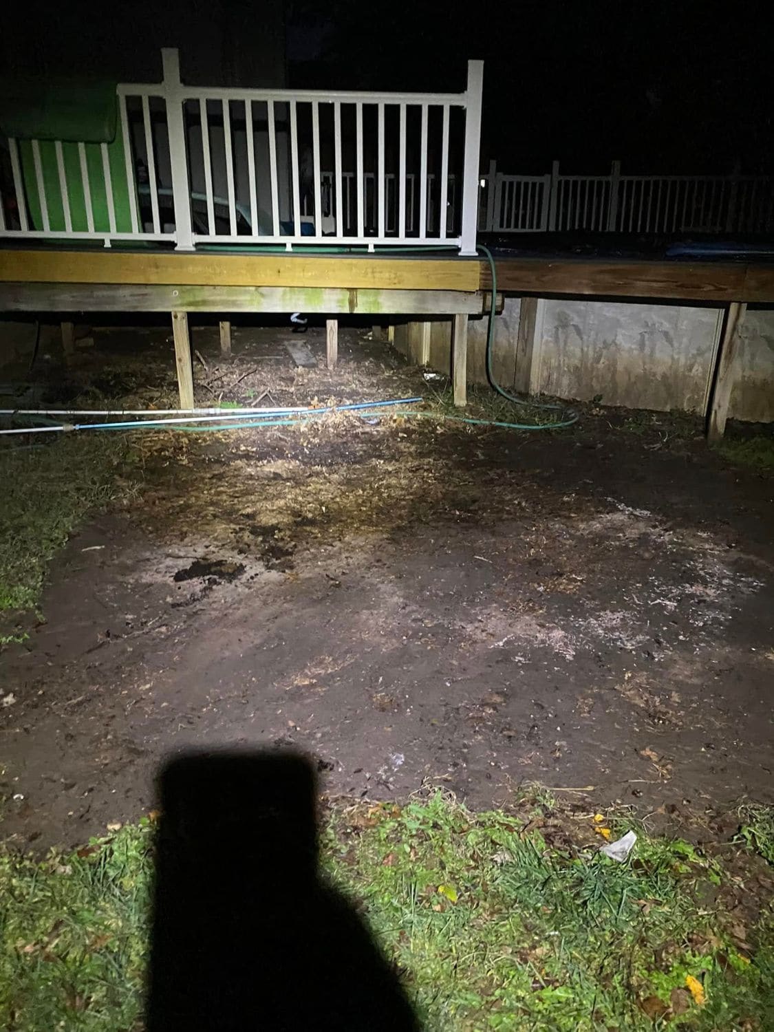 The same area beside the deck cleared, photographed at night by flashlight